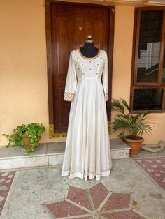 Hand embroidered Anarkali  / cream anarkali suit set / white anarkali dupatta USA / Indian anarkali/ Indian dresses/ voggish / cream anarkali dress          Looking for a perfect indian dress/anarkali/suit sets that are trendy, unique and easy to carry !! yess, You are at the right place. we carry such versatile pieces of anarkalis and suit sets that really let you stand out in any occassion !!      featuring this beautiful pure chanderi dress in cream color with hand embroidered on body  and sl Long Sleeve Chanderi Anarkali Set With Dori Work, Off White Anarkali Gown With Dupatta, Designer Floor-length Cream Salwar Kameez, Designer Cream Floor-length Salwar Kameez, Long Sleeve Anarkali Set With Dori Work For Diwali, Floor-length Off White Salwar Kameez For Festivals, Festival Floor-length Off White Salwar Kameez, Traditional Off White Gown For Designer Wear, Traditional Off White Designer Gown