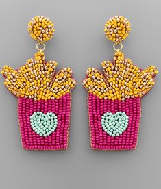 a pair of earrings made out of beads and beaded with an image of fries