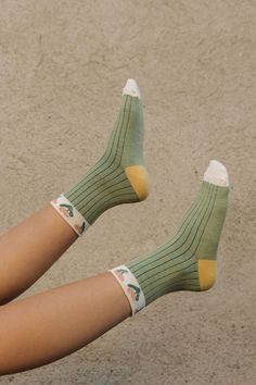 Satisfy your sock game with Candice Socks! These cozy crew socks feature a playful striped pattern and cute floral trim that'll keep your feet feeling fresh and funky. Step up your style with these green and cream beauties. Candice Socks-Green/Cream, boutique clothing, casual, the perfect socks! Boutique Clothing Trendy Green Cotton Socks, Cute Cream Socks For Spring, Cute Cream Spring Socks, Cute Green Socks For Spring, Green Summer Socks, Green Cotton Winter Socks, Trendy Green Socks For Spring, Playful Green Winter Socks, Green Cotton Summer Socks