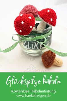 two crocheted mushrooms sitting in a jar