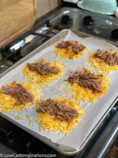 some food is sitting on top of a baking sheet in the oven and ready to go into the oven