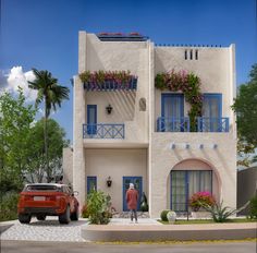 a red car parked in front of a white building with blue windows and balconies