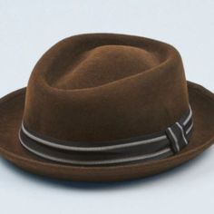 Unisex-Handcrafted By Expert Artisans Made Of 100% Wool - Water Repellent Lined Internally With 100% Cotton Weight - 0.5lbs. Dimension - 12" X 11" X 4". Brim Size - 2” Vintage Fitted Brown Panama Hat, Fitted Vintage Brown Panama Hat, Classic Fitted Six-panel Felt Hat, Fitted Brown Boater Hat With Flat Brim, Brown Fitted Boater Hat With Flat Brim, Classic Brown Hat For Kentucky Derby, Fitted Brown Hat For Kentucky Derby, Fitted Brown Boater Hat For Kentucky Derby, Brown Brimmed Hat For Kentucky Derby