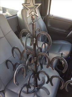 a car seat with a star on top of it and horseshoes in the center