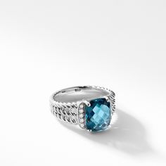 Inspired by the fluid rhythm and graceful line of unharvested wheat, the Wheaton(R) Collection accentuates slender strands of David Yurman's signature Cable motif with uniquely faceted gemstones. Sterling silver Faceted Hampton Blue Topaz, 10x8mm Pave Diamonds, 0.08 total carat weight Ring, 4mm wide Size 7 Style Number: R11028DSSAAMDI7 Petite Jewelry, Bridal Engagement Rings, Engagement Ring Styles, Faceted Gemstones, Diamond Sizes, David Yurman, Diamond Gemstone, Halo Diamond, Pave Diamonds