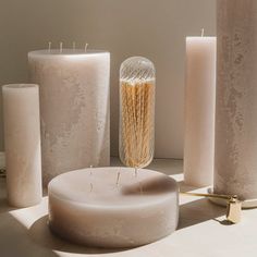 some candles are sitting next to each other