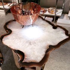 a table that has some kind of bowl on it