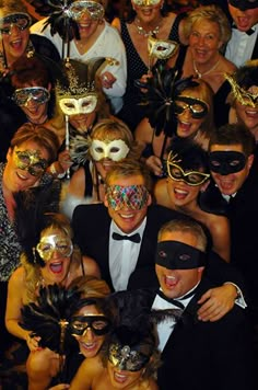 a group of people with masks on posing for a photo