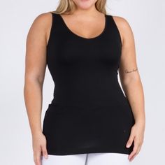 This Will Become Your Fave, Go To Top. I Live In Mine! This Is The Long Version Of This Cami. Available In Shorter Version In My Closet. This Is Reversible. One Side Is A U-Neck. Flip It Around And It Becomes A V-Neck! Two In One Style. One Plus Size. Very Stretchy. This Seamless Tank Makes Styling Any Outfit A Breeze! Featuring A V-Neckline And Fitted Silhouette In A Buttery, Soft Fabric That's Very Comfortable For Wearing All Day. Wide Shoulder Straps V-Neckline Back Scoop Neck Fitted Silhouet Snug Fit Sleeveless Tops With Built-in Bra, Black Stretch Camisole With Built-in Bra, Black Camisole With Built-in Bra For Layering, Black Stretch Seamless Tank Top, Sporty Black Cami Top, Black Seamless Tank Top For Yoga, Black Seamless Racerback Top, Black Seamless Construction Shapewear Top, Black Tops With Medium Support And Seamless Design