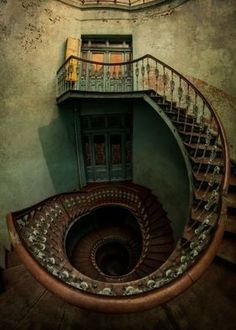 a spiral staircase in an old building