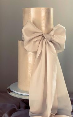 a wedding cake with a large bow on top