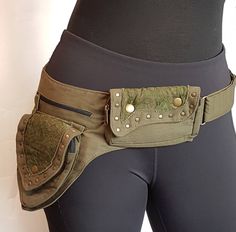 Utility pocket belt in army green Adjusts to 48 inch hip/waist measurement. Gold tone metal hardware & lace detail. 5 pocket design. Have your hands free while on the go! Biking, shopping, at concerts & events, traveling, biking & more. Fantastic gift for a friend or family member. See my whole collection of pocket belts here: https://www.etsy.com/ca/shop/VintageindiaCA?ref=seller-platform-mcnav&section_id=34445559 Exactly as shown in photos. What you see is what you get. In stock and ready to s Travel Money Belt, Rave Dance, Festival Belt, Burning Man Fashion, Etsy Boutique, Leather Bound Journal, Money Belt, Utility Belt, Bronze Gold