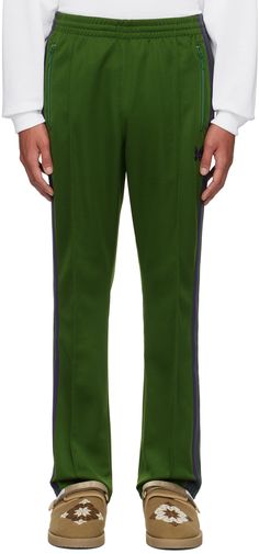 Polyester jersey track pants. · Concealed drawstring at elasticized waistband · Three-pocket styling · Logo embroidered at front · Pinched seams at front · Striped rib knit trim at outseams Supplier color: Ivy green Mens Activewear, Logo Embroidered, Track Pants, Apparel Accessories, Ivy, Rib Knit, Active Wear, Fashion Inspo, Track