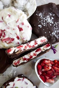 chocolate covered pastries with strawberries and whipped cream