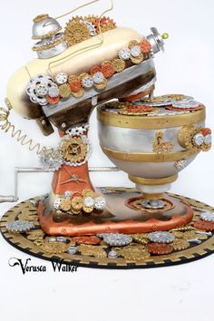 an old fashioned telephone is sitting on top of a stand with buttons and chains attached to it