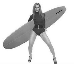 a woman holding a surfboard with the caption if you like it, then you should have fun on it