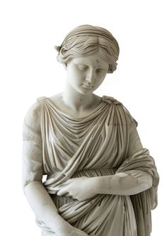 a statue of a woman with her arms crossed