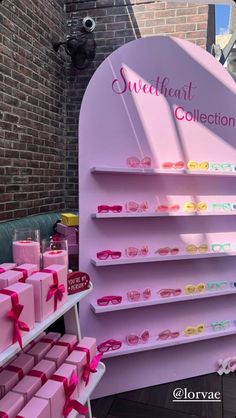 a pink display with lots of different items on it