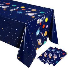 an image of a table cloth with outer space designs on it and placemats