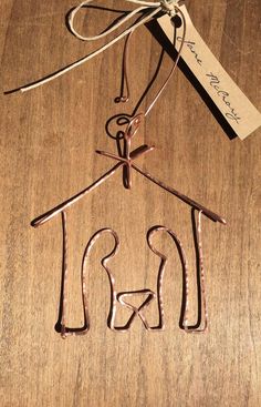 a wire hanger with the word iron hanging from it's clothesline on a wooden surface