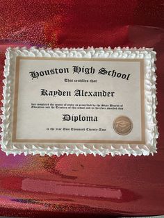 a diploma certificate on top of a red chair