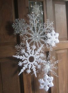 a snowflake hanging from the side of a door