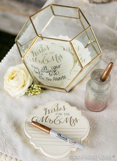 a close up of a table with flowers and other items