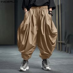 SPECIFICATIONS Brand Name: INCERUN Applicable Season: Four Seasons Origin: Mainland China CN: Guangdong Material: POLYESTER Applicable Scene: CASUAL Pant Style: Wide leg pants Style: Casual Craft of Weaving: TAT Model Number: Solid Color Men Irregular Pants Thickness: midweight Waist Type: MID Decoration: none Gender: MEN Item Type: full length Place Of Origin: China (mainland) Closure Type: Elastic Waist Fabric Type: Broadcloth Length: full length Front Style: Pleated Fit Type: LOOSE Color: Black,Khaki,Grey Size: S,M,L,XL,2XL,3XL,4XL,5XL,Plus Size {custom} Size:S,M,L,XL,2XL,3XL,4XL,5XLFabric Material:100%PolyesterColor:Black,Khaki,GreyOccasion:LeisurePattern:Solid colorProduct Description:Men's Solid Color Harem Pants Casual Pants Style, Trousers Men, Casual Pant, Romper Suit, Men Trousers, Loose Trousers, Black Khakis, Isle Of Man, Mens Streetwear