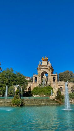 a large fountain in the middle of a park