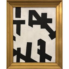 a painting with black and white letters in a gold frame