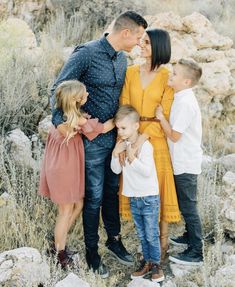 a family poses for a photo in the desert