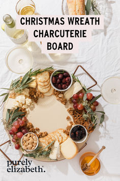 christmas wreath charcuterie board with grapes, nuts and crackers on the side