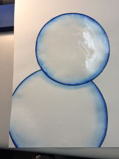 a white and blue painting with two circles on the bottom, one circle is smaller than the other