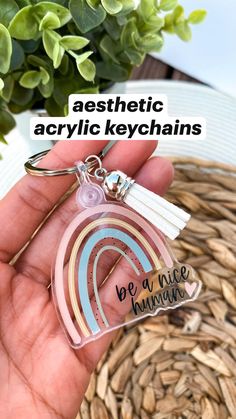 someone is holding a keychain that says aesthetic acrylic keychains