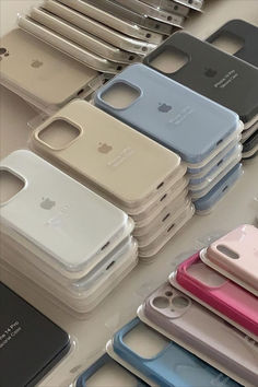 there are many different colored cases on the table with each one's own phone