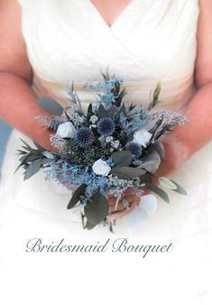 a woman in a white dress holding a bouquet of blue flowers and greenery with the words, bridesmaid bouquet