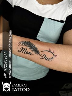 a woman with a tattoo on her arm that reads mom and has an arrow in the middle