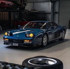 a blue sports car parked in a garage