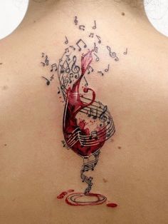 a woman's back with music notes and a glass of wine