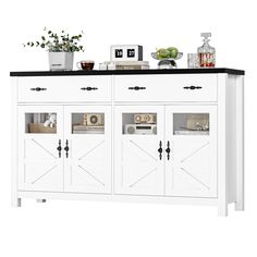 a white cabinet with black top and doors