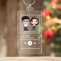 a keychain with an image of two people holding hands and the words michael & amanda on it