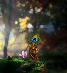 there is a small statue with a peacock on it's head and a flower in the foreground