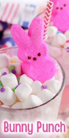 two cups filled with marshmallows and pink bunny decorations