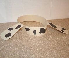 two dalmatian dog collars laying on the floor