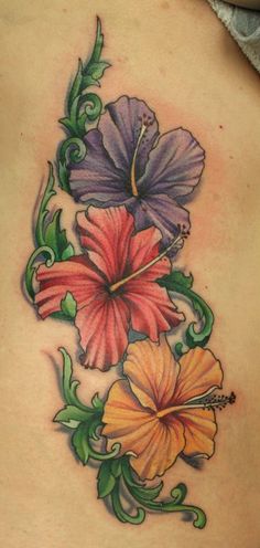 the back of a woman's stomach with flowers on it