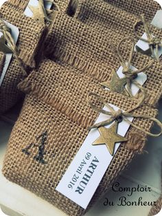 twine wrapped presents with gold stars on them