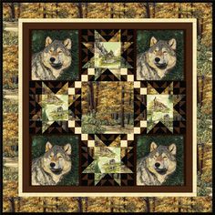 a quilt with two wolfs on it is hanging from the side of a wall