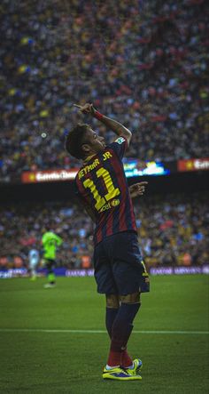 a man standing on top of a soccer field