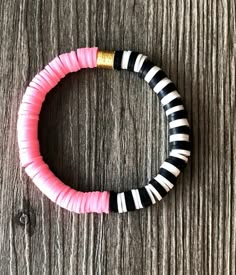 Black/White and Color Heishi Disc Stacking Bracelet with Gold | Etsy Sports Heishi Bracelets, Pink Heishi Bracelet, Black Heishi Bracelet Ideas, Heishi Bracelet Ideas Preppy, Disc Bracelet Ideas, Cute Heishi Bracelets Ideas, Black Clay Bead Bracelet Ideas, Black And White Clay Bead Bracelet, Disc Bead Bracelet Ideas