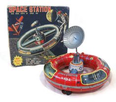 an inflatable space station is next to a box